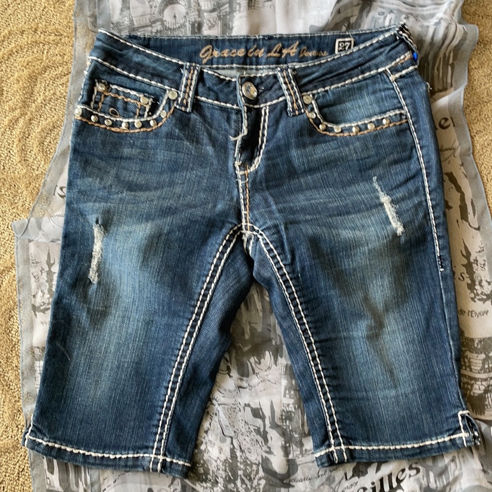 GRACE in LA distressed shorts.